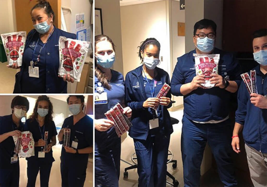 Photo of healthcare workers with GoodPop products.