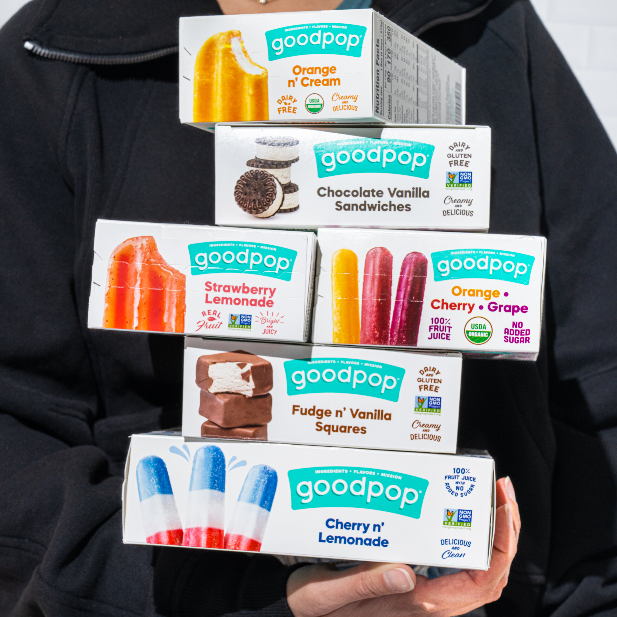 Person holding boxes of goodpop