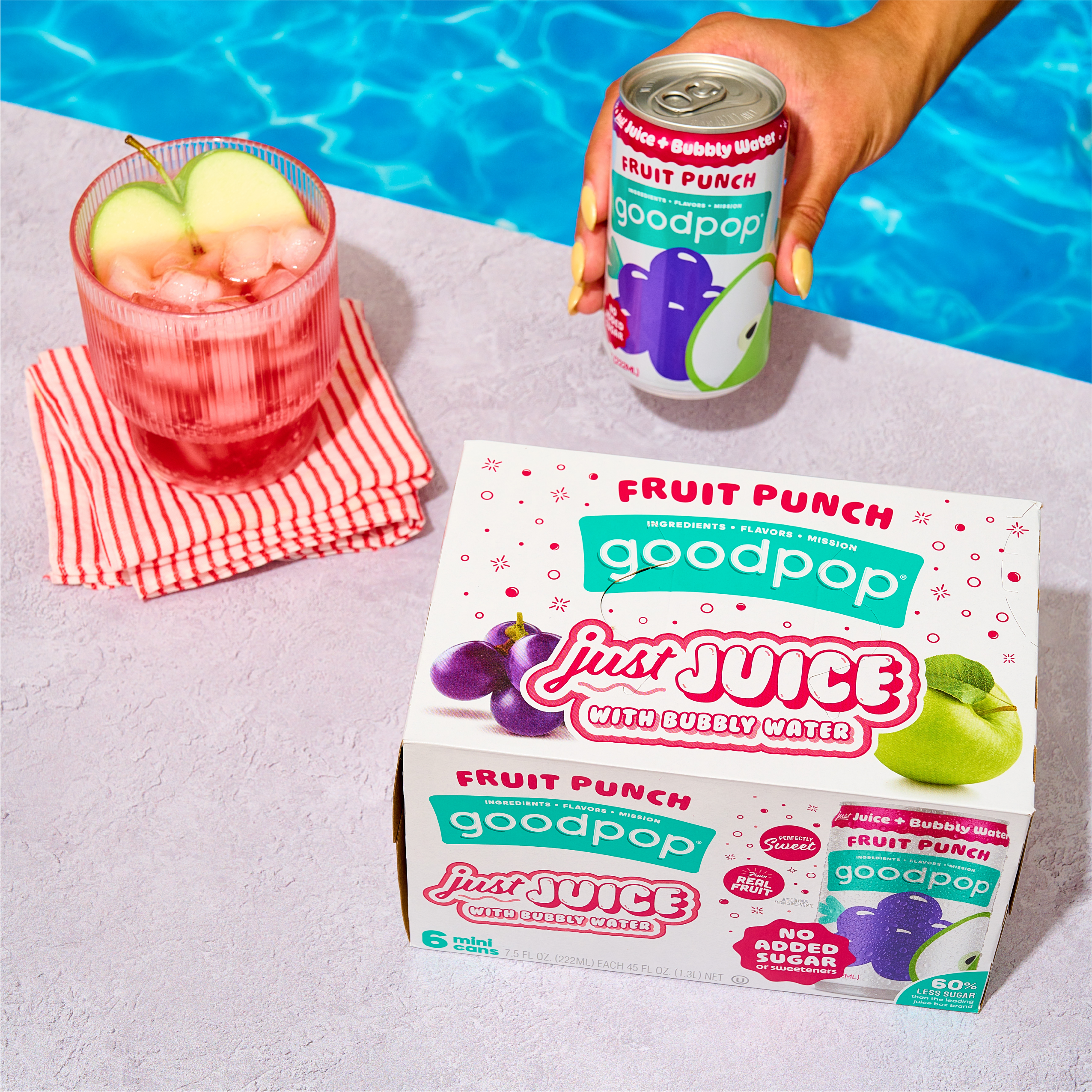 Woman enjoys GoodPop Fruit Punch Mini Cans pool side