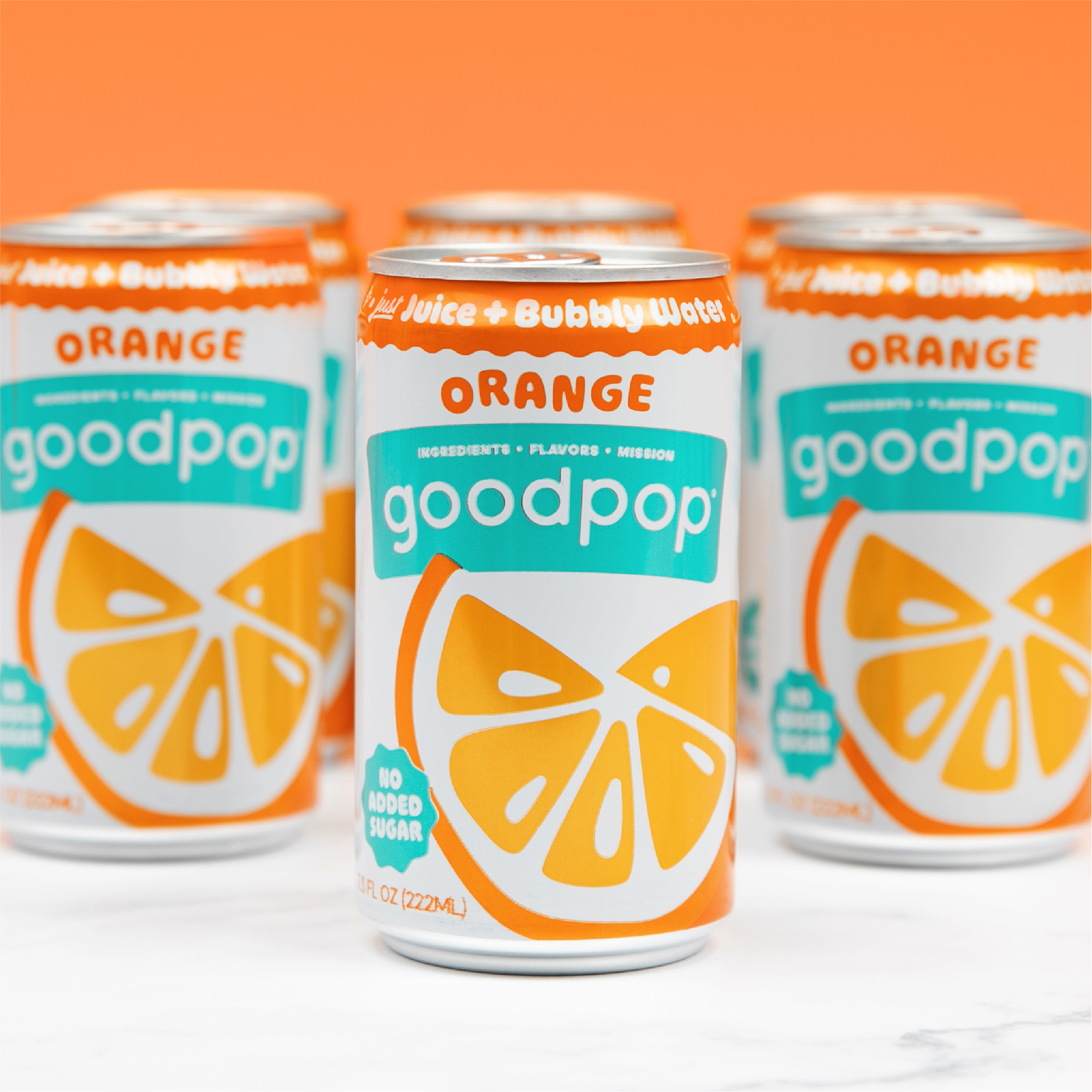 Rows of GoodPop Orange Mini Cans with bright orange background