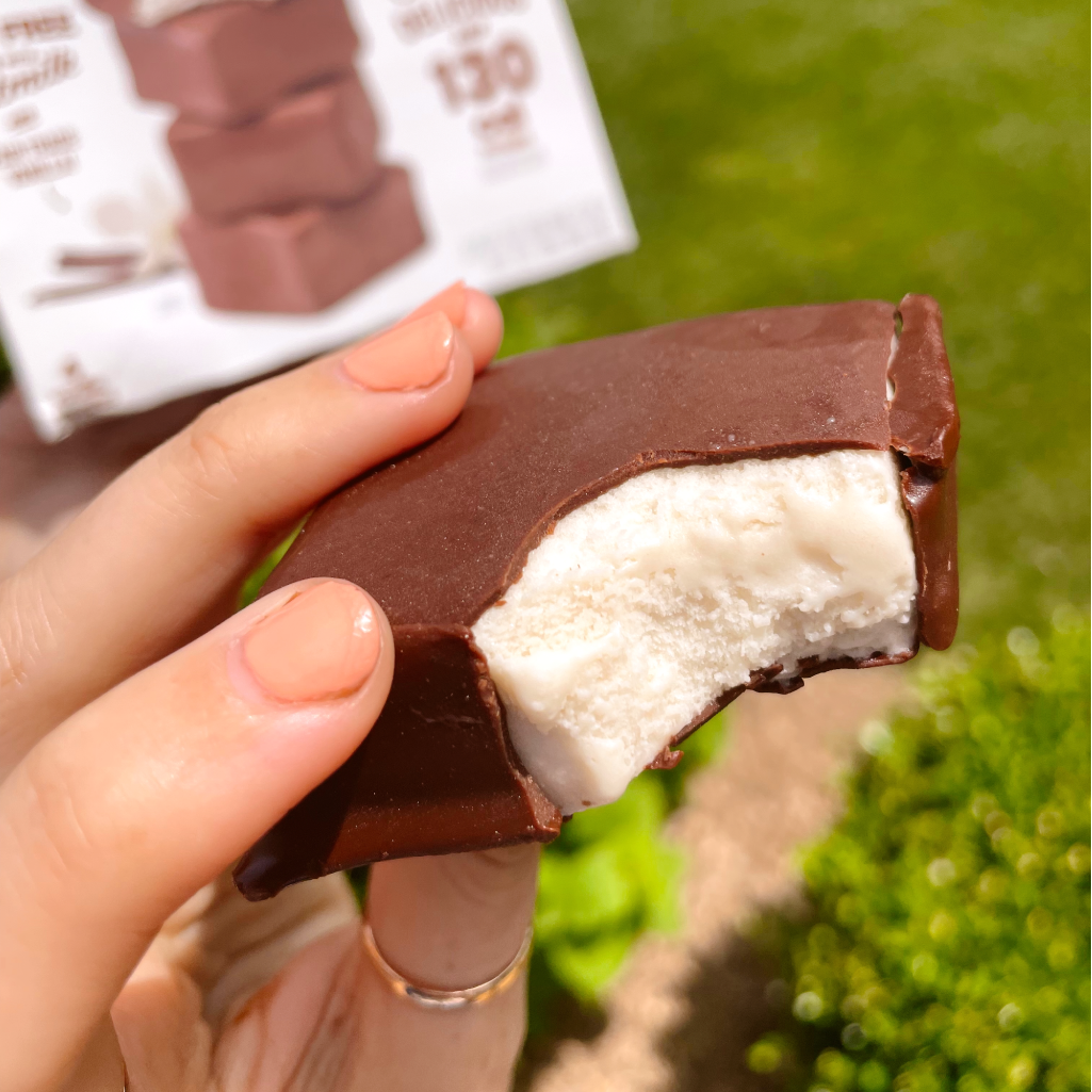 Woman holding GoodPop Fudge n' Vanilla Squares