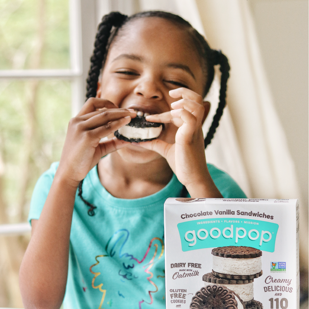 Girl enjoying GoodPop Chocolate Vanilla Sandwhiches